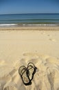 Flip flops on beach Royalty Free Stock Photo
