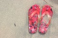 Flip Flops on the beach sand texture background