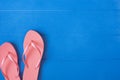 Flip flops on blue wooden background. Summer concept. Flat lay, top view, copy space Royalty Free Stock Photo