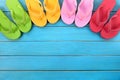 Flip flops in a row, summer background border, copy space Royalty Free Stock Photo