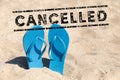 Flip flops in the sand and text cancelled - vacation cancel