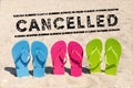 Flip flops in the sand and text cancelled - vacation cancel