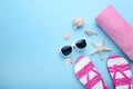 Flip flops with seashells and towel Royalty Free Stock Photo