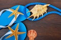 Flip-flops, starfish and seashells. Royalty Free Stock Photo