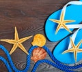 Flip-flops, starfish and seashells. Royalty Free Stock Photo