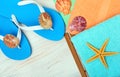 Flip-flops, towels, starfish and seashells. Royalty Free Stock Photo