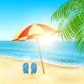 Flip flops and umbrella on the beach Royalty Free Stock Photo