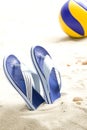 Flip-flops and volleyball ball