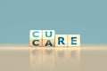 flip letter cubes and changes the word `CARE` to `CURE`