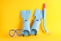 Flippers, snorkel and diving mask on yellow background Royalty Free Stock Photo