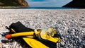 Flippers and snorkeling tube on sea shore Royalty Free Stock Photo