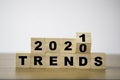 Flipping 2020 to 2021 trends print screen on wooden block cubes. New idea business fashion popular and relevant topics Royalty Free Stock Photo