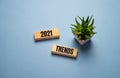 Flipping 2020 to 2021 trends print screen on wooden block cubes. New idea business fashion popular and relevant topics. Royalty Free Stock Photo