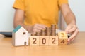 2023 flipping to 2024 year block with house model and Coins stack. real estate, Home loan, tax, investment, mortgage, financial, Royalty Free Stock Photo