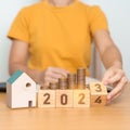 2023 flipping to 2024 year block with house model and Coins stack. real estate, Home loan, tax, investment, mortgage, financial, Royalty Free Stock Photo