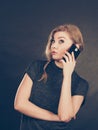 Attractive woman flirting texting on mobile phone. Royalty Free Stock Photo