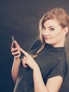 Attractive woman flirting texting on mobile phone. Royalty Free Stock Photo