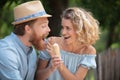 flirtatious couple in park sharing ice-cream