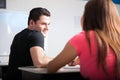 Flirting in a classroom Royalty Free Stock Photo