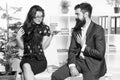 Flirting colleagues. Bearded man and attractive woman. Man and woman conversation coffee time. Office rumors. Office Royalty Free Stock Photo