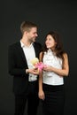 Flirting and dating. Love and romance. Gift with love. Couple on romantic date. Formal couple with toy. Man and woman