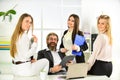 Flirting and seduction. Secretary and manager. Office affair. Flirting with boss. Surrounded by beautiful ladies. Man Royalty Free Stock Photo