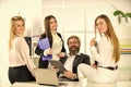 Flirting and seduction. Secretary and manager. Office affair. Flirting with boss. Surrounded by beautiful ladies. Man Royalty Free Stock Photo