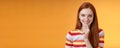 Flirty devious creative young redhead smiling excited ginger girl prepare mysterious gift surprise party giggling tricky Royalty Free Stock Photo