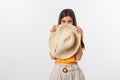 Flirty funky caucasian woman hiding behind fashionable trendy red head wear, with wide open eyes Royalty Free Stock Photo