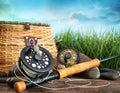 Flly fishing equipment and basket Royalty Free Stock Photo