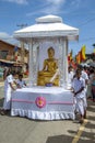 A float carrying a golden statue of Lord Buddha at the Buddhist perahera procession at Hikkaduwa in Sri Lanka.