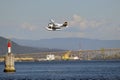 Float Plane taking off in Vancouver, Canada. Float plane taking off from the Vancouver Harbour terminal at Burrard Landing in Brit Royalty Free Stock Photo