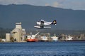 Float Plane taking off in Vancouver, Canada. Royalty Free Stock Photo