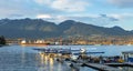 Float planes docked at Vancouver`s Harbour Airport during sunset. Air seaplanes at Vancouver Harbour Flight Airport