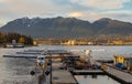 Float planes docked at Vancouver`s Harbour Airport during sunset. Air seaplanes at Vancouver Harbour Flight Airport