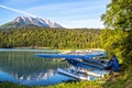 Float planes on Upper Trail Lake in Moose Pass on the Kenai Peninsula of Alaska. Snow topped mountain reflected in lake - Royalty Free Stock Photo