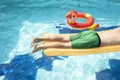 Floater with parrot shape an a man at swimming pool Royalty Free Stock Photo