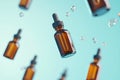 Floating amber glass dropper bottles on a blue background Royalty Free Stock Photo