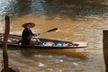 Floating asian vendors on long wooden boat Royalty Free Stock Photo