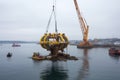 floating barge with crane installing ocean turbine Royalty Free Stock Photo