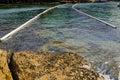 Floating Barrier Naturally Collects Ocean Waste for traping plastic bags, bottles, and other waste. Royalty Free Stock Photo