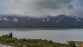 Floating blue ice floes and icebergs are visible in the glacial lake. Royalty Free Stock Photo