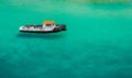 Floating Boat in Esmerald Water