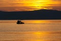 Floating boat during sunset