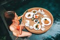 Floating breakfast in infinity pool on paradise swimming pool, morning in the tropical resort Bali, Indonesia Royalty Free Stock Photo