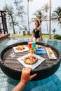 Floating breakfast in infinity pool on paradise swimming pool, morning in the tropical resort bungalow Royalty Free Stock Photo