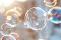 Floating bubbles shine in the sunlight, reflecting colors and creating a light display. They drift gently in the air, capturing Royalty Free Stock Photo