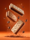 Floating chocolate filled rectangular crackers with coffee beans against an orange background Royalty Free Stock Photo