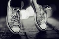 Floating through the city streets. Cropped image of a person wearing sneakers standing on their toes in the street. Royalty Free Stock Photo