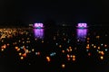 Floating colored lanterns and garlands on river at night on Vesak day for celebrating Buddha's birthday in Eastern culture, that